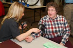 A staff member gets her blood pressure read at the annual health fair sponsored by the Optimal Health Committee.